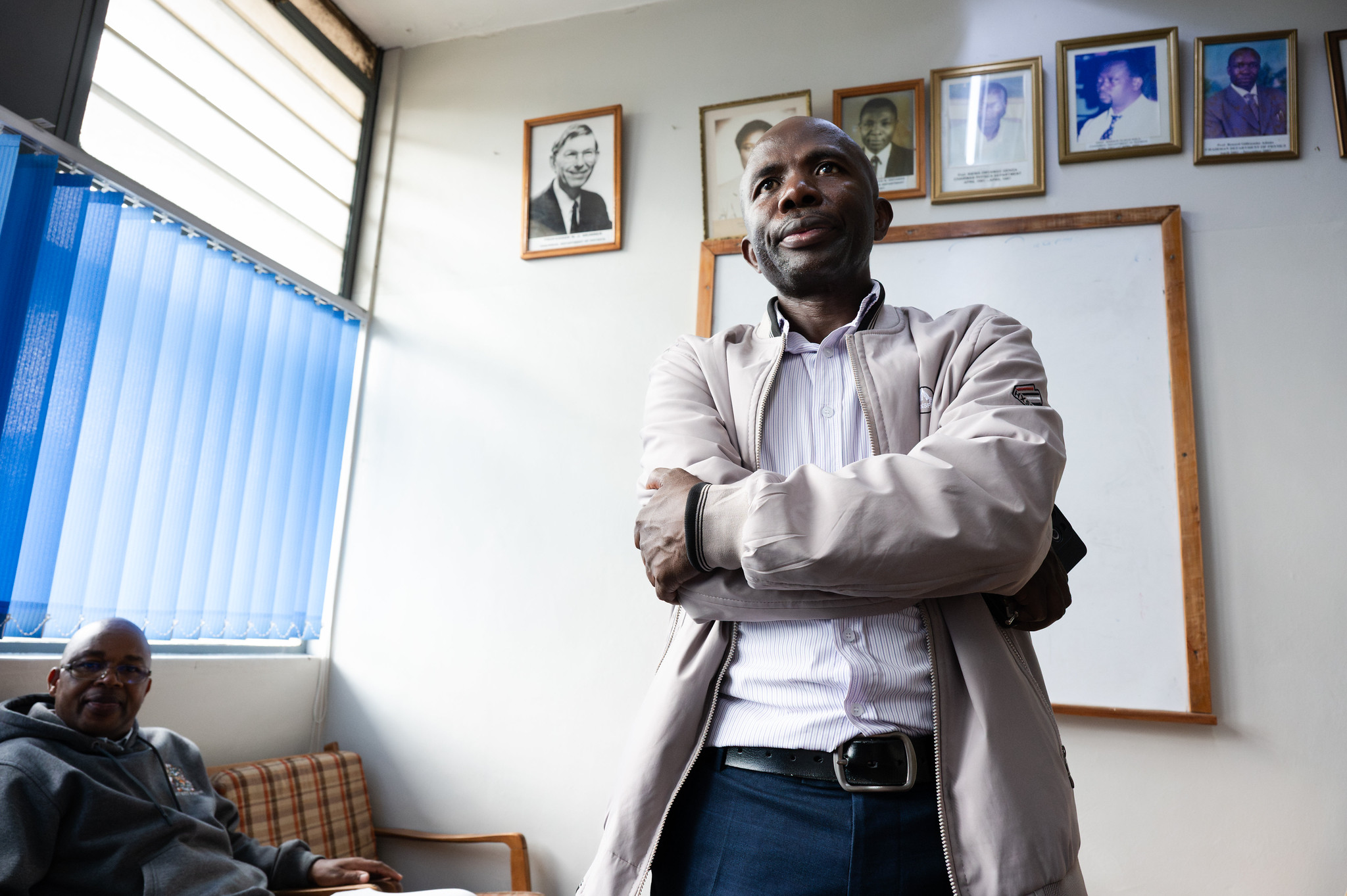 TWAS Research Grant awardees Justus Julius Okonda (centre), lecturer in the Department of Physics at the University of Nairobi, and Zephania Birech, chair of the department.